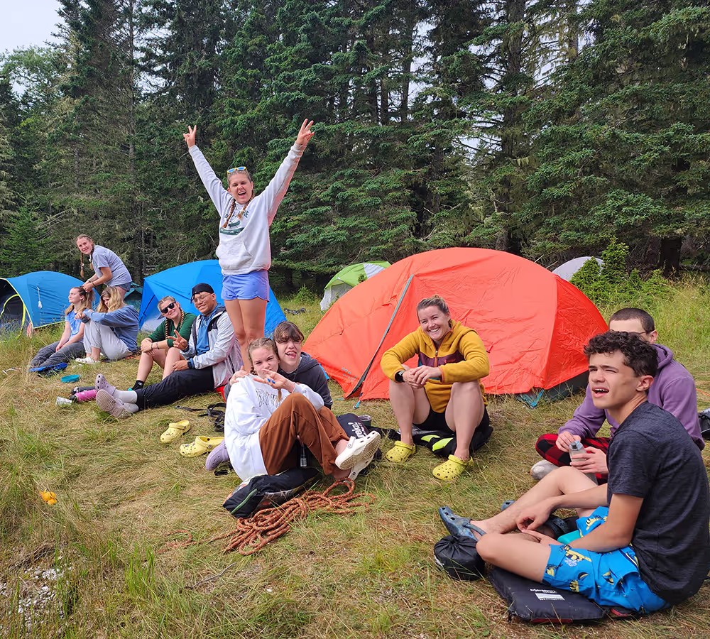 Campers spending time together at their campsite