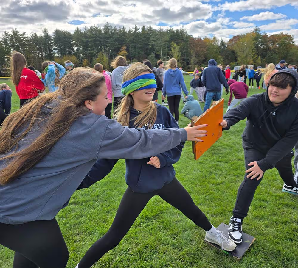Students working together on a group challenge